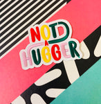 Not a Hugger 4 inch iron on patch, designed by latenightcrew AU.