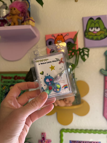 A Weird Little Object 6, blue silver sword