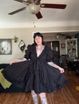 Black Selkie dress size xl, low cut lots of bows and ruffles (only tried on). Retails $369