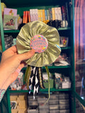 Green Certified Clown Ribbon Badge, handmade in sage with bows