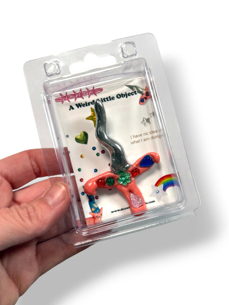 A Weird Little Object 9, pink sword