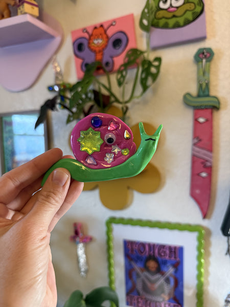 Imperfect snail wall hanging (green and pink), A Weird Little Object, clay and gloss