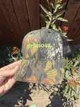 Girlmoss unstructured on camo dad hat with lime green thread.