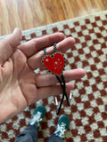 Heart Shapes Bolo Tie is Red, Black or Green. On vegan rope.